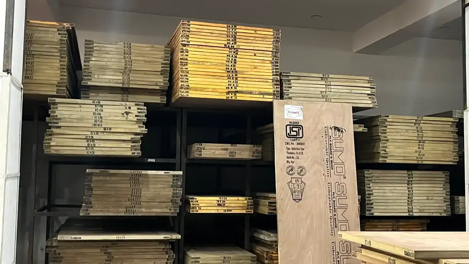Wide warehouse inventory of coloured and natural boards on industrial shelving