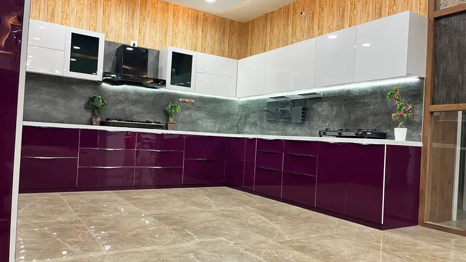 Purple gloss modular kitchen display with hob, chimney hood and tall pantry unit