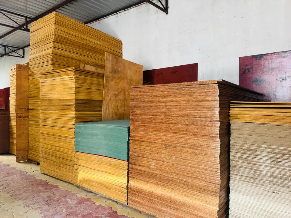 Tall stacks of plywood sheets stored on warehouse racks
