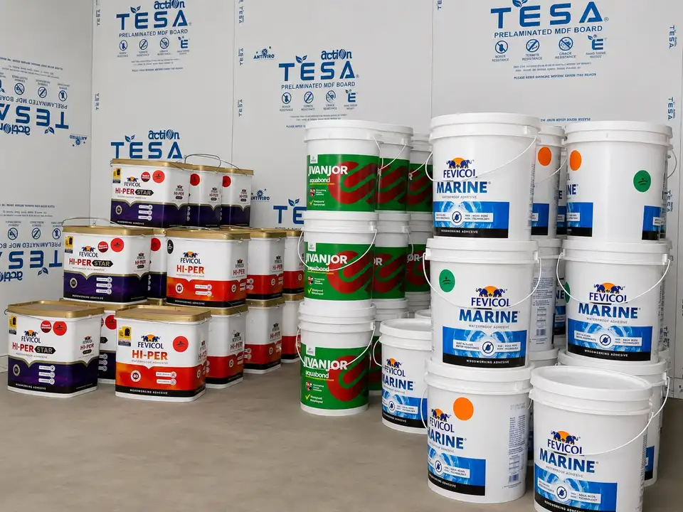 Stacked Fevicol and Jivanjor adhesive buckets and tubs in the storeroom
