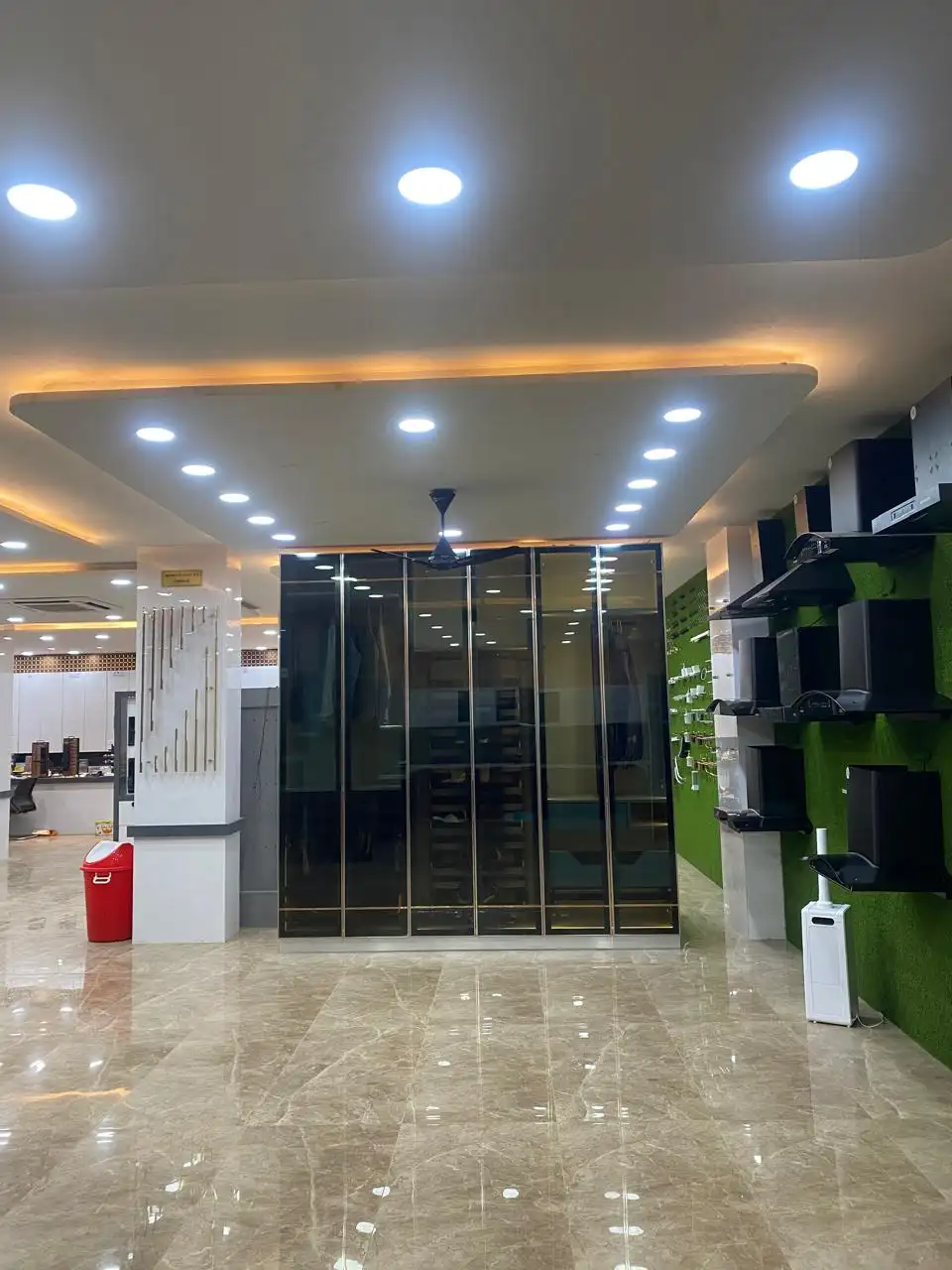 Black glass six-door wardrobe display unit in the showroom